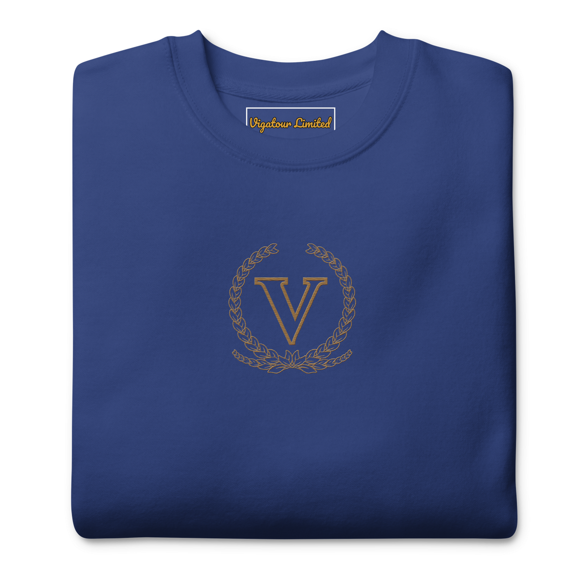 Core V Sweatshirt in Team Royal, folded, close-up of the embroidered V crest. Vigatour Mark I
