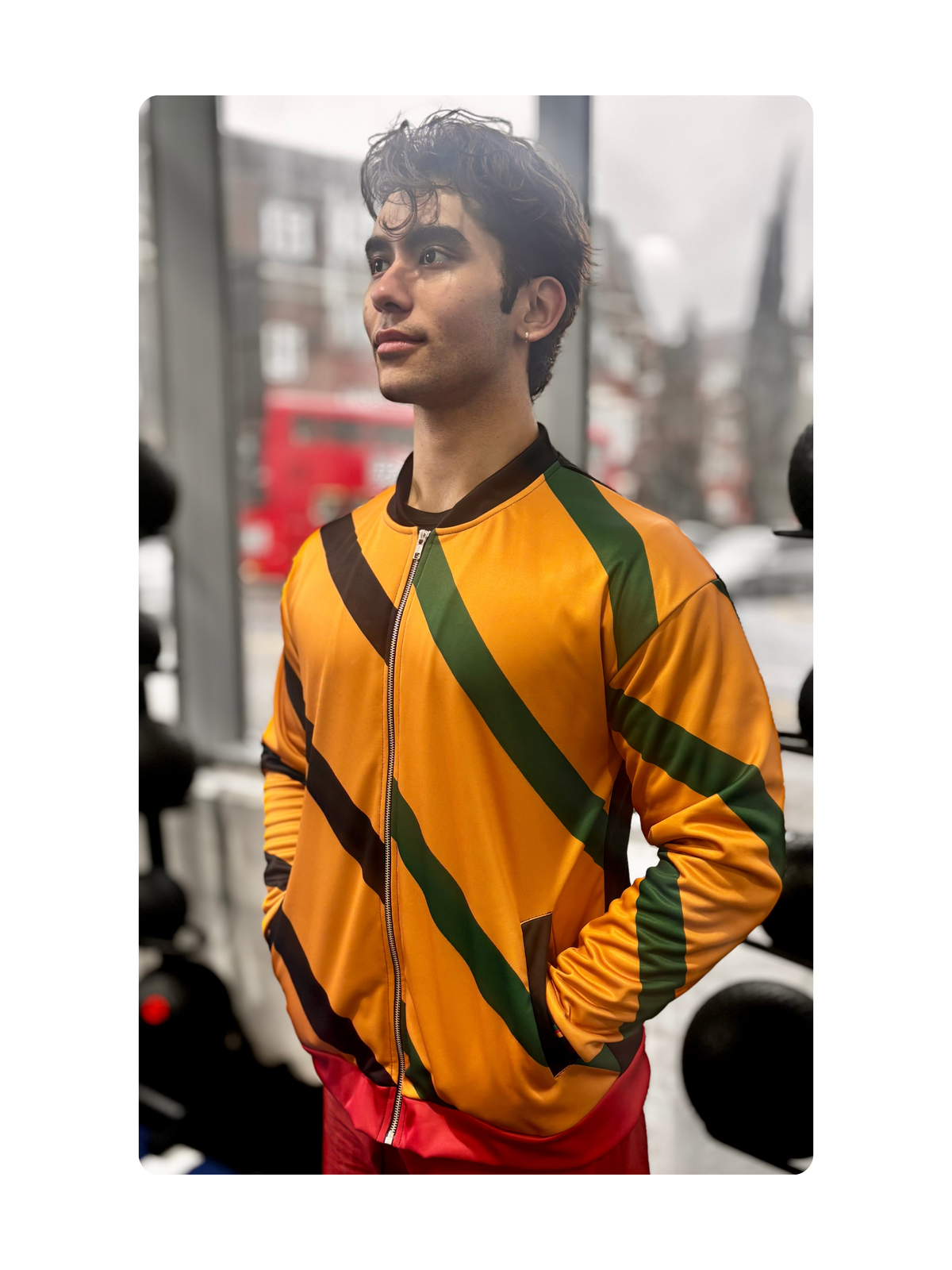 Man wearing the Pan African Heritage Bomber Jacket on a city street. Vigatour Mark I