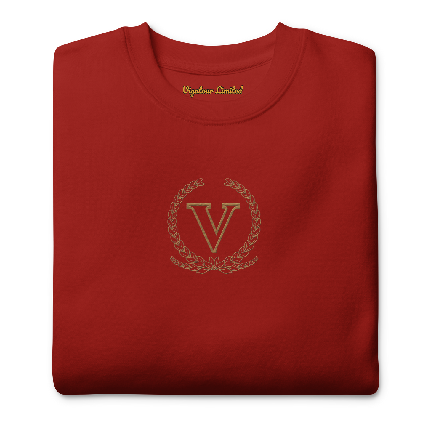 Folded red sweatshirt with a gold logo and text on a white background