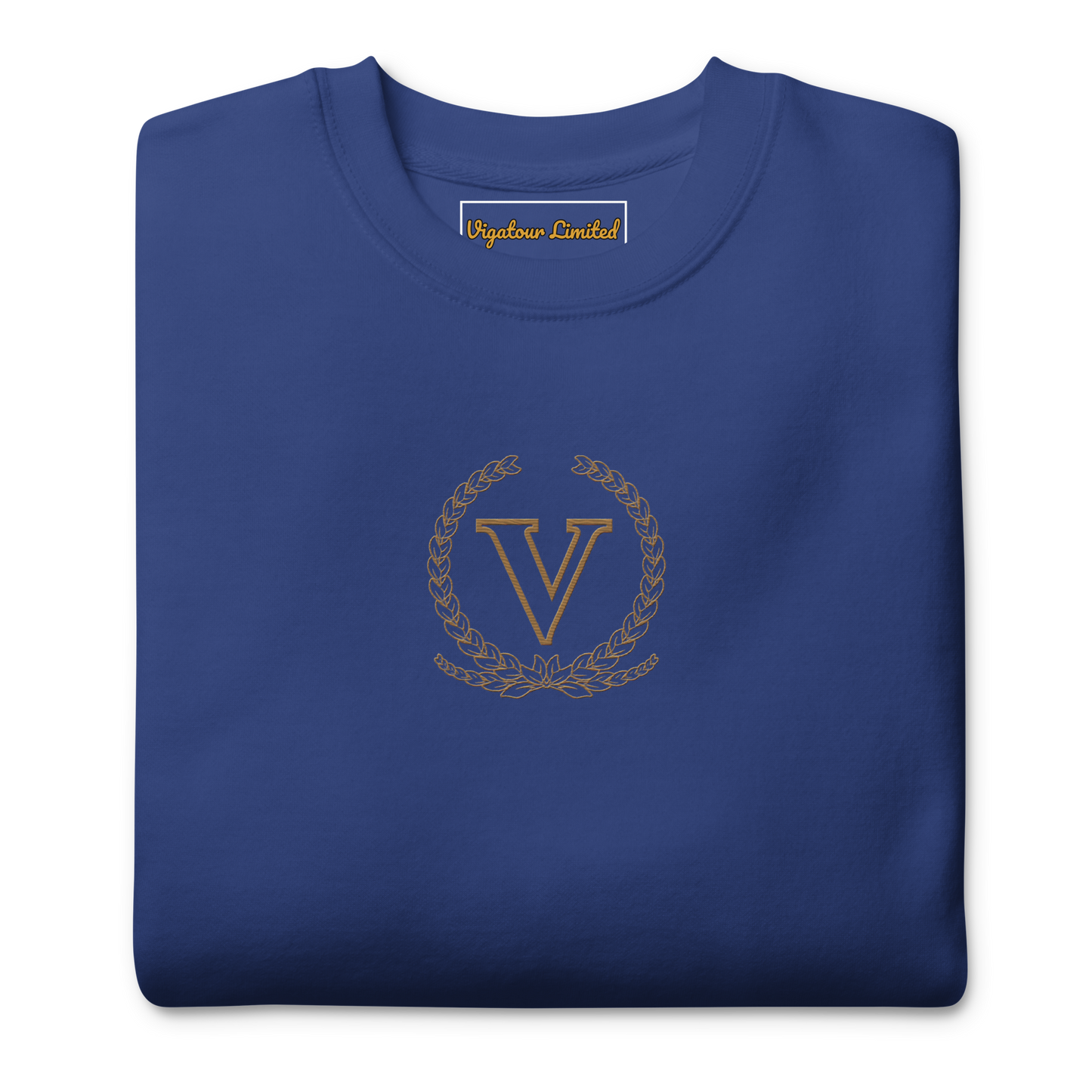 Folded blue sweatshirt with gold emblem and 'V' on a white background