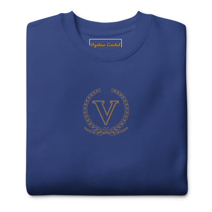 Core V Sweatshirt in Team Royal, folded, close-up of the embroidered V crest. Vigatour Mark I
