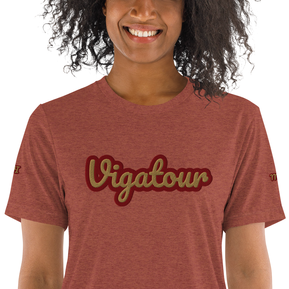 Person wearing a red t-shirt with 'Vigatour' text on a white background