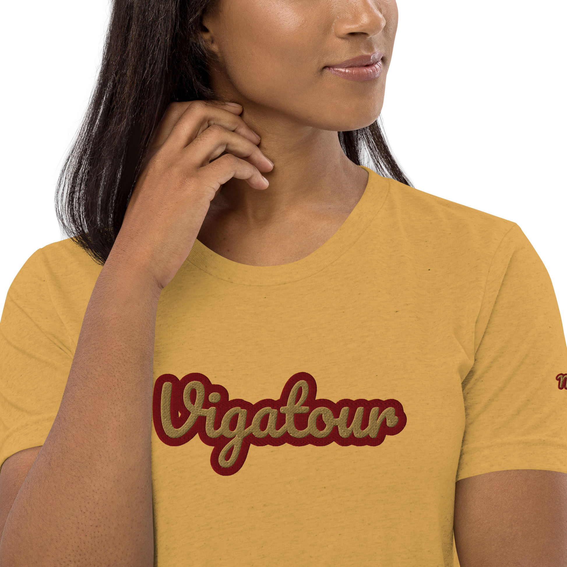 Woman wearing a yellow t-shirt with 'Vigatour' printed on it against a white background