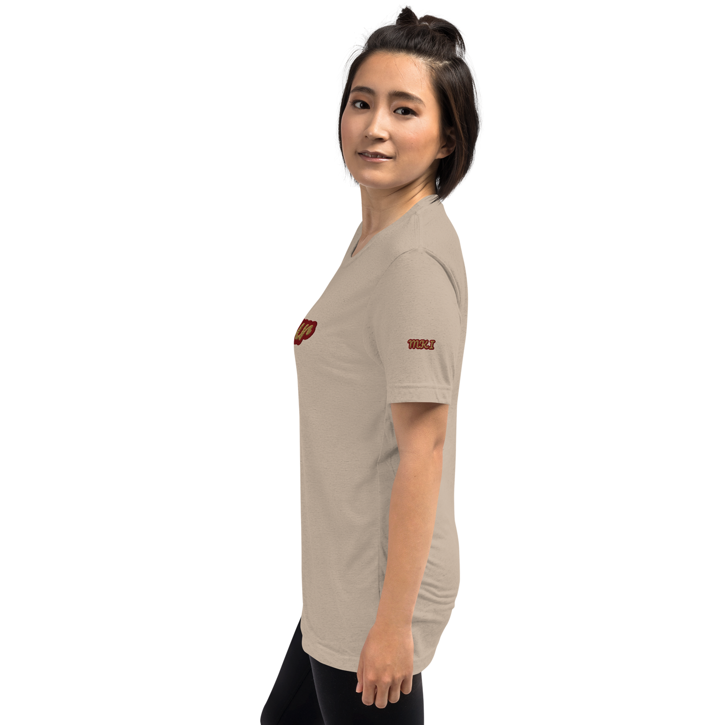 Woman wearing a beige t-shirt with a logo on a white background