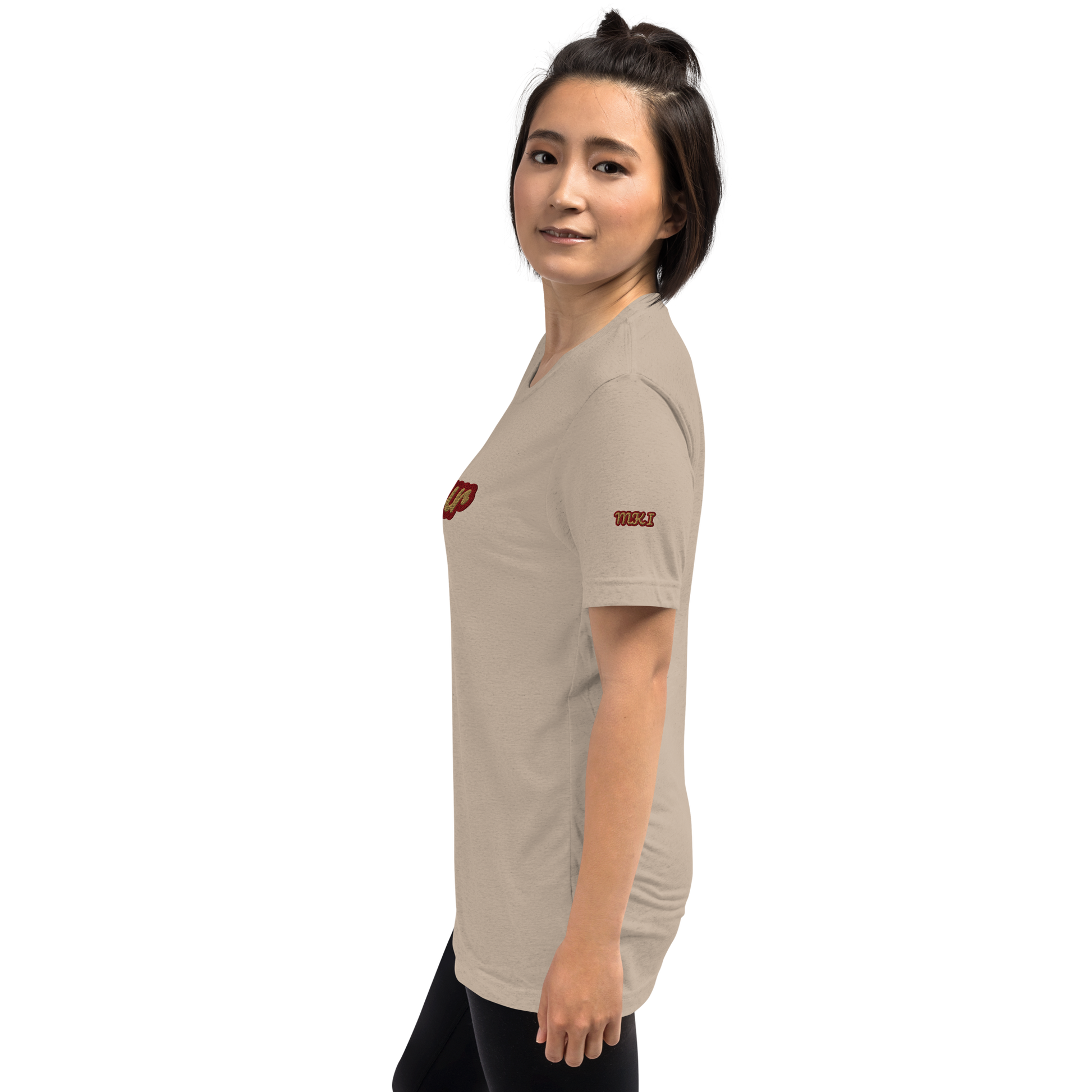 Woman wearing a beige t-shirt with a logo on a white background